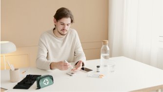 A man checking his health using a device.